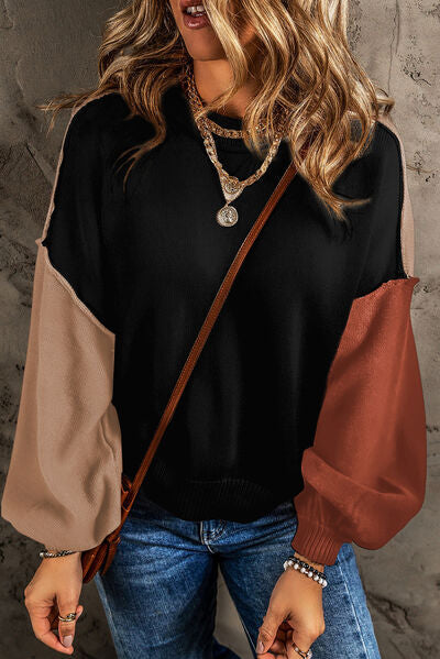 Introducing our Trendsi Trends Contrast Round Neck Dropped Shoulder Sweater for women! Enjoy effortless elegance with this relaxed top, featuring long puffy sleeves in contrasting colors. Perfect for any season, elevate your wardrobe with this luxurious and versatile piece of casual apparel.