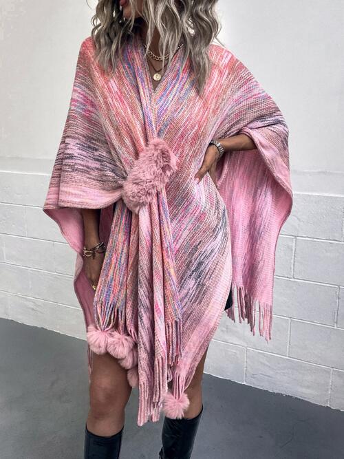 The Heathered Fringe Hem Poncho from Trendsi Trends showcases an oversized wrap and broad tie in a lively blend of hues, including carnation pink and ivory. Elevate your ensemble with this poncho, which offers a cozy and fashionable method for staying warm in an array of bold colors.