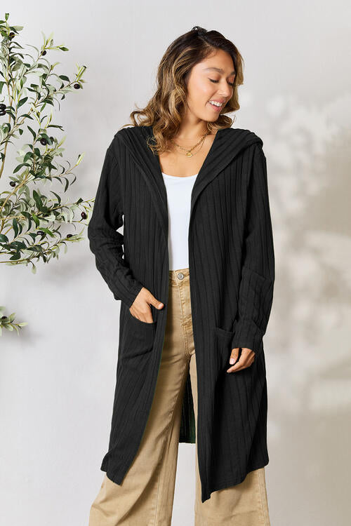 Discover the luxurious yet affordable Basic Essential Full Size Hooded Sweater Cardigan for women, available in sizes small to 3XL. This essential garment comes equipped with practical pockets, making it a functional addition to any wardrobe.