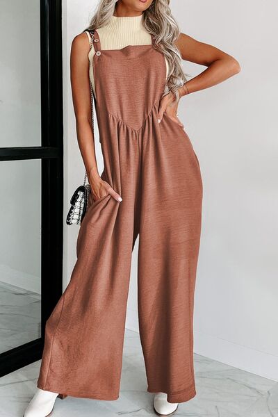 Unleash your daring side with Trendsi Trends Tie Waist Jumpsuit! Embrace the excitement of a designer and wide-leg design. The waist tie adds a touch of refinement to this thrilling ensemble.