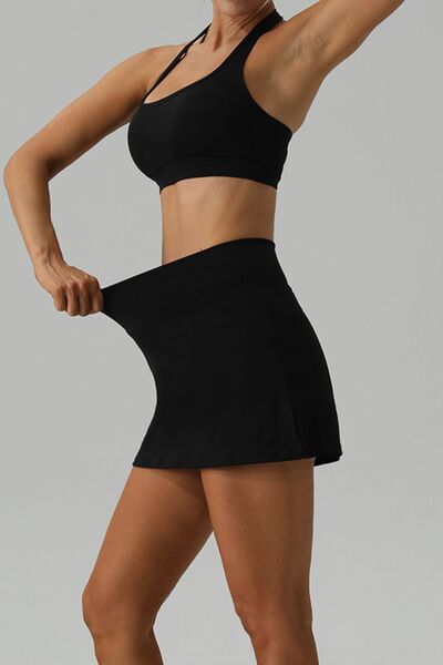 Unleash the daring in you with the Trendsi Trends Halter Neck Tank and Slit Skirt Active Set! Conquer any challenge and push your limits in this bold and eye-catching two-piece outfit, designed for all your active pursuits. Whether you're sprinting through your day, pounding the pavement, or finding inner peace through yoga or meditation, this set is perfect to fuel your adventurous spirit. Moderate stretch.