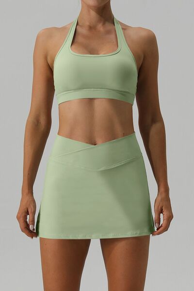Unleash the excitement of the Trendsi Trends Halter Neck Tank and Slit Skirt Active Set! Embrace your boldness and conquer any task with this striking and attention-grabbing two-piece ensemble, ideal for any active pursuit. No matter if you're racing through your schedule, pounding the pavement, or seeking inner calm through yoga or meditation, this set will match your adventurous vibe.