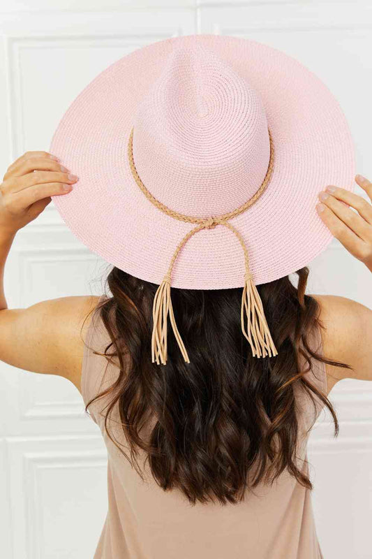 Trendsi Trends Hat Collection. A trendy straw hat that adds a boho, cowgirl vibe to any outfit. The woven material ensures comfort and breathability. Also has a chic faux leather braid and adjustable straps.